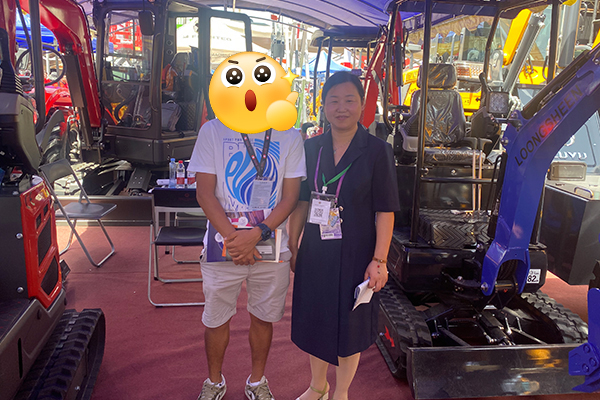 Mini excavator product demo at Loongsheen expo display with visitors