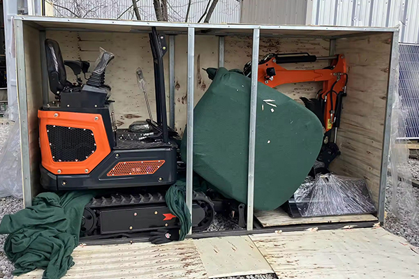 Mini excavator packed inside container with spare parts for overseas dealers