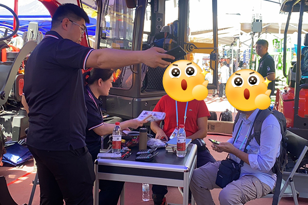 Skid steer loader attachment explanation at construction equipment show